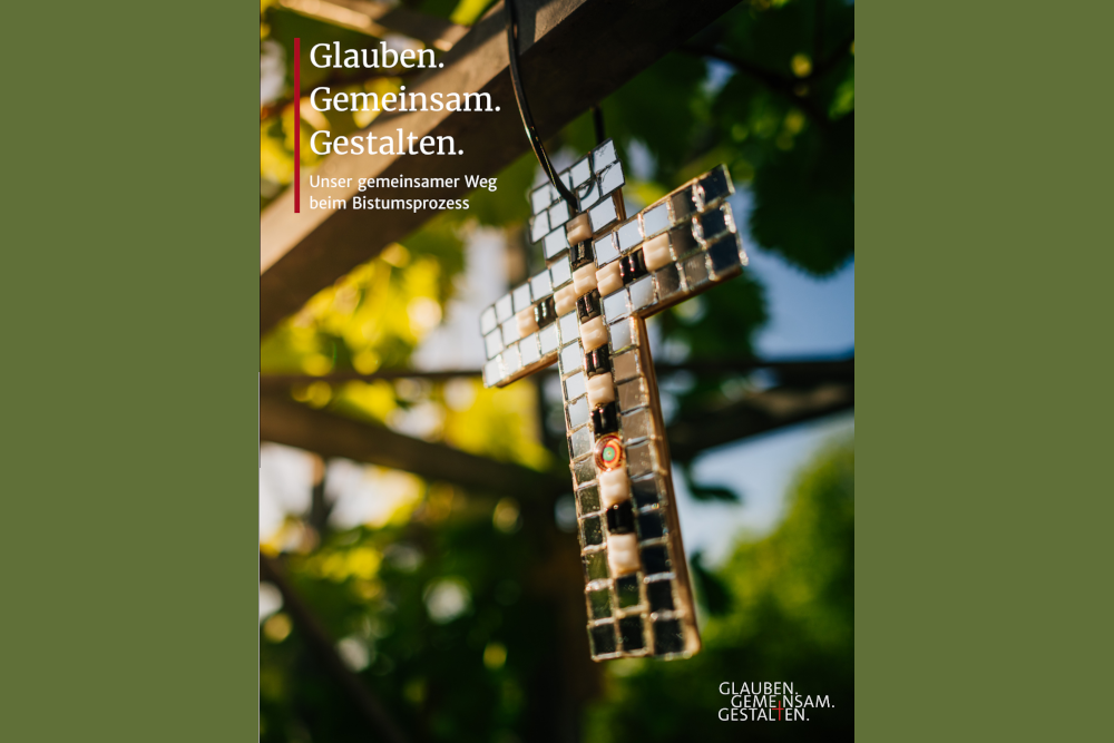 Foto mit Kreuz und dem Motto: Glauben Gemeinsam Gestalten