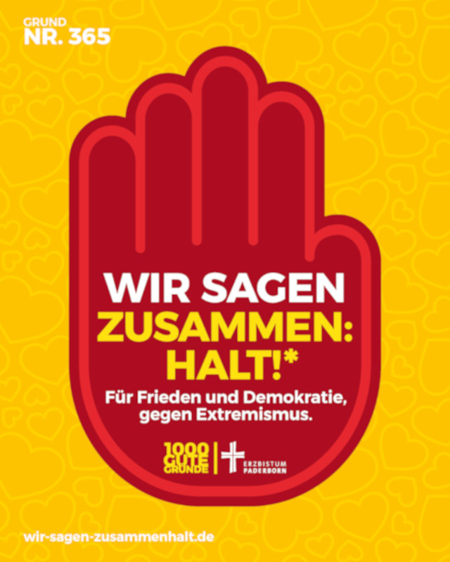 Plakat in einer roten Hand auf gelben Untergrund steht: Wir sagen Zusammen Halt!